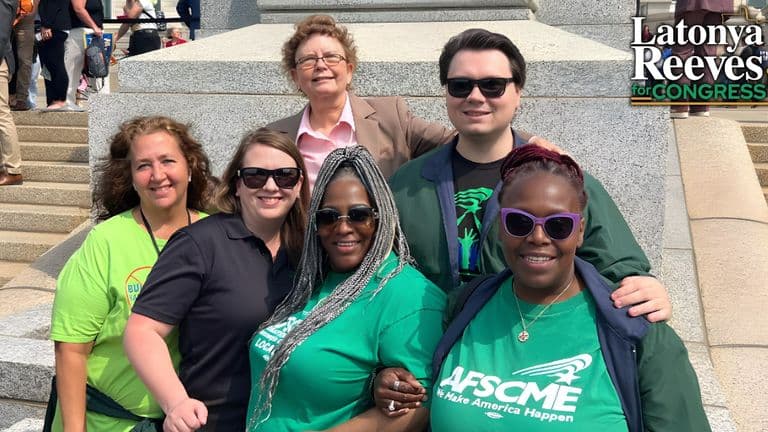 Latonya Reeves with supporters at a rally, advocating for transparency, justice, and community-focused leadership for Minnesota’s 5th District.
