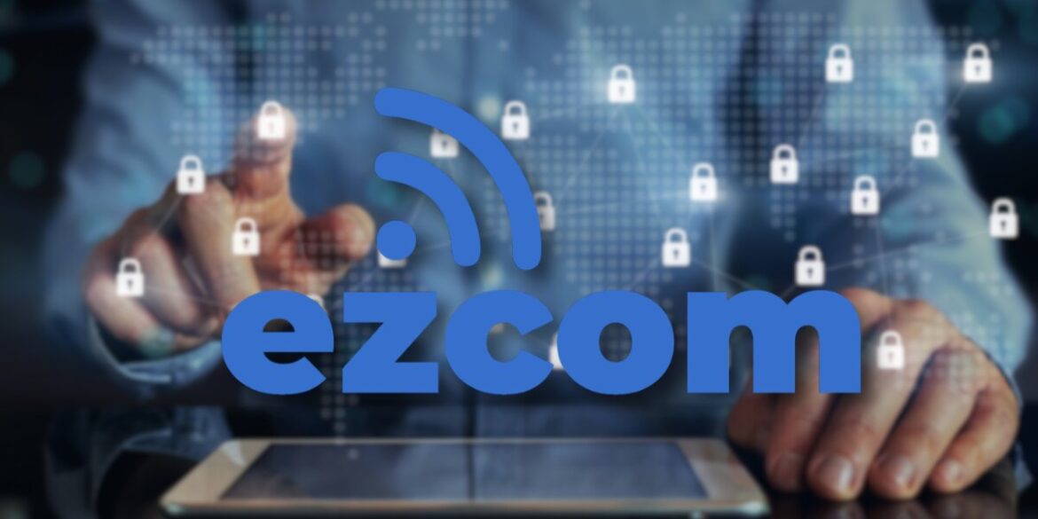 A person interacts with a tablet, touching virtual lock icons on a digital world map. The word "ezcom" is overlaid in bold blue text, conveying connectivity.